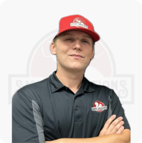 Staff member wearing Smart Solutions Pest Control polo and cap with arms crossed against a white background